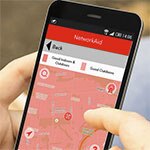 hand holding a phone showing device aid