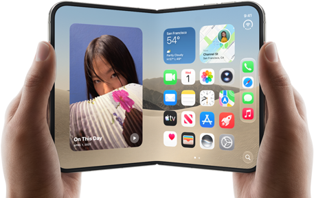 iPhone Duo, Star White colour, held by two hands in landscape orientation, unfolded, interior screen displays photos on the left, apps on the right
