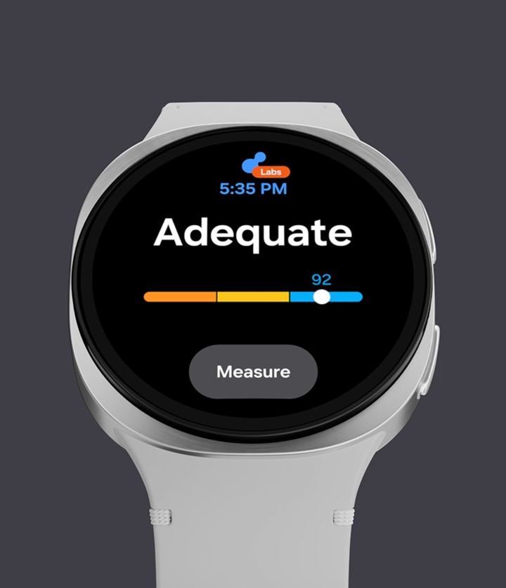 A person's thumb is placed on a sensor on the back of Galaxy Watch8, and the screen displays the Antioxidant index as 'Adequate' with a score of 92. A 'Measure' button is shown at the bottom.